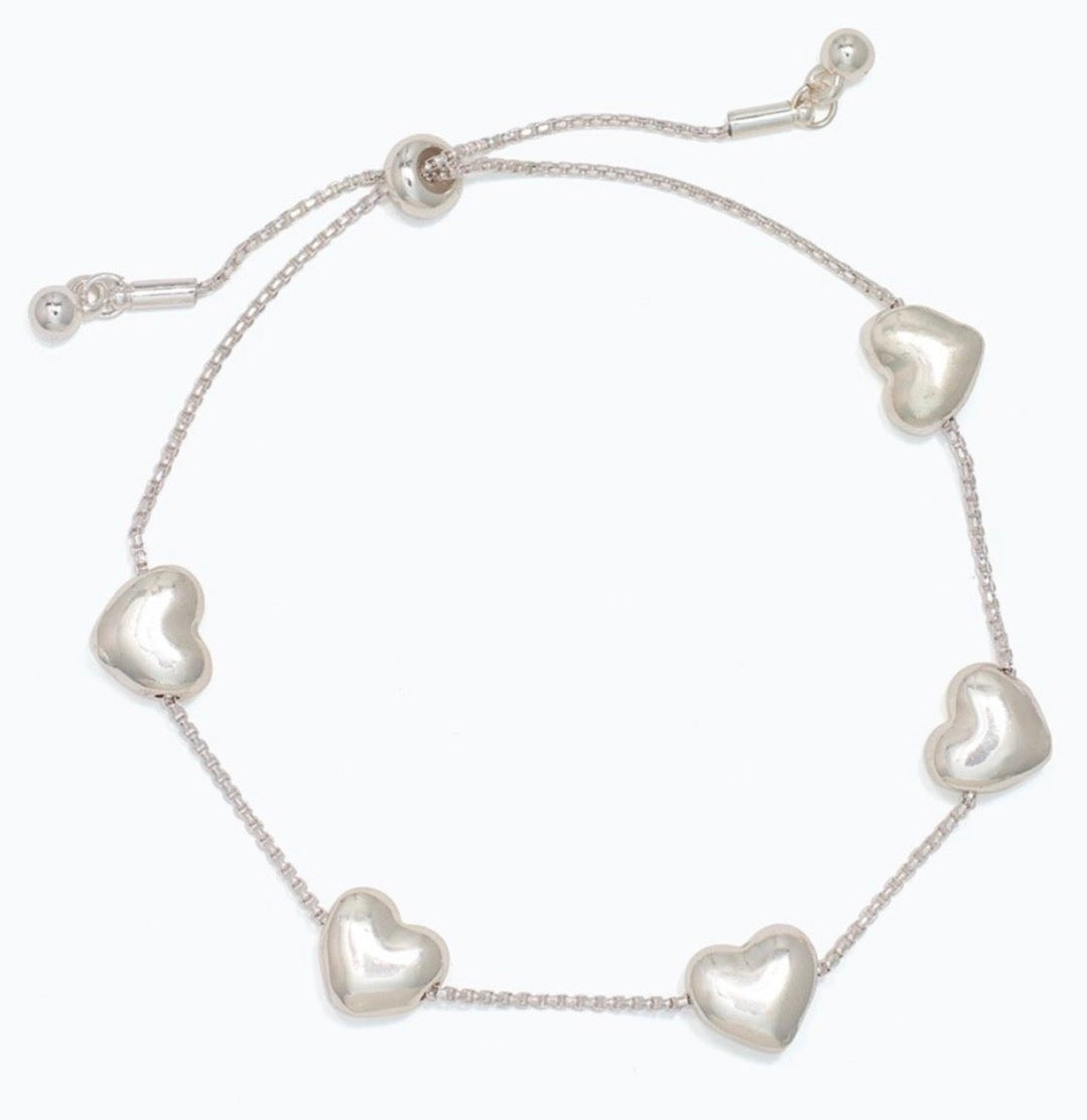 Periwinkle Stationed puffy silver hearts Bracelet