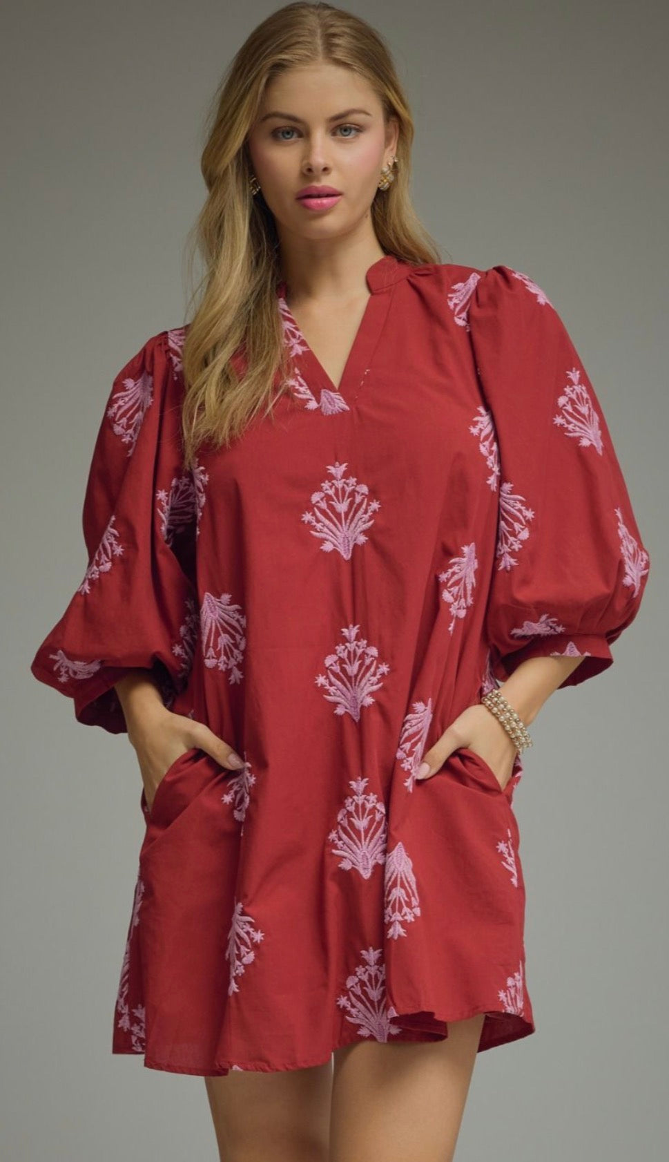 Entro Embroidered 3/4 puff sleeve mini dress featuring V-neck. Pocket at side. Lined. Woven. Non-sheer. Lightweight.