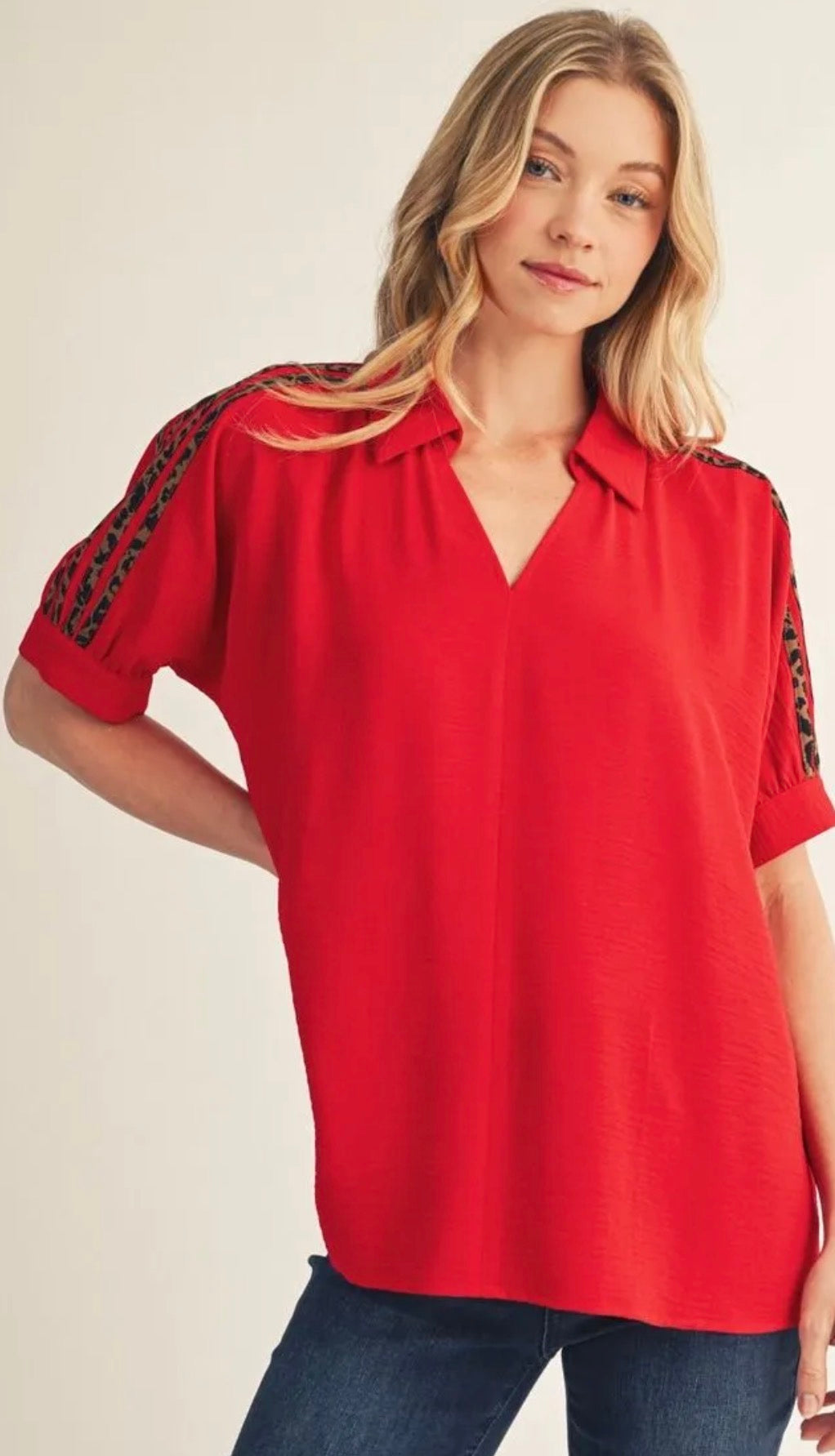 Jodifl Drop shoulder crinkled solid top with leopard contrast shoulder detail.
