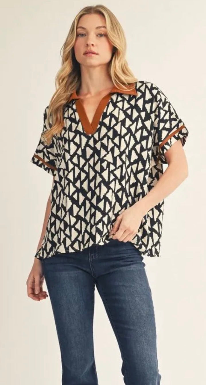 Jodifl Plus size drop shoulder Geo print top with color contrast v neckline & collar.