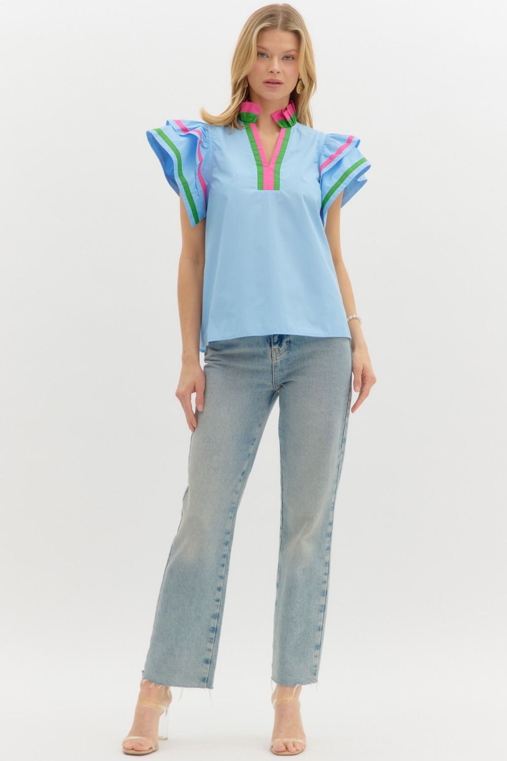 Entro Chambray Solid flutter sleeve pullover top features multicolor accented ruffle neck and sleeve finish. Unlined. Woven. Non-sheer. Lightweight.